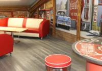 Rote American-Diner-Sitzbank mit weissem Tisch vor einer Backsteinwand